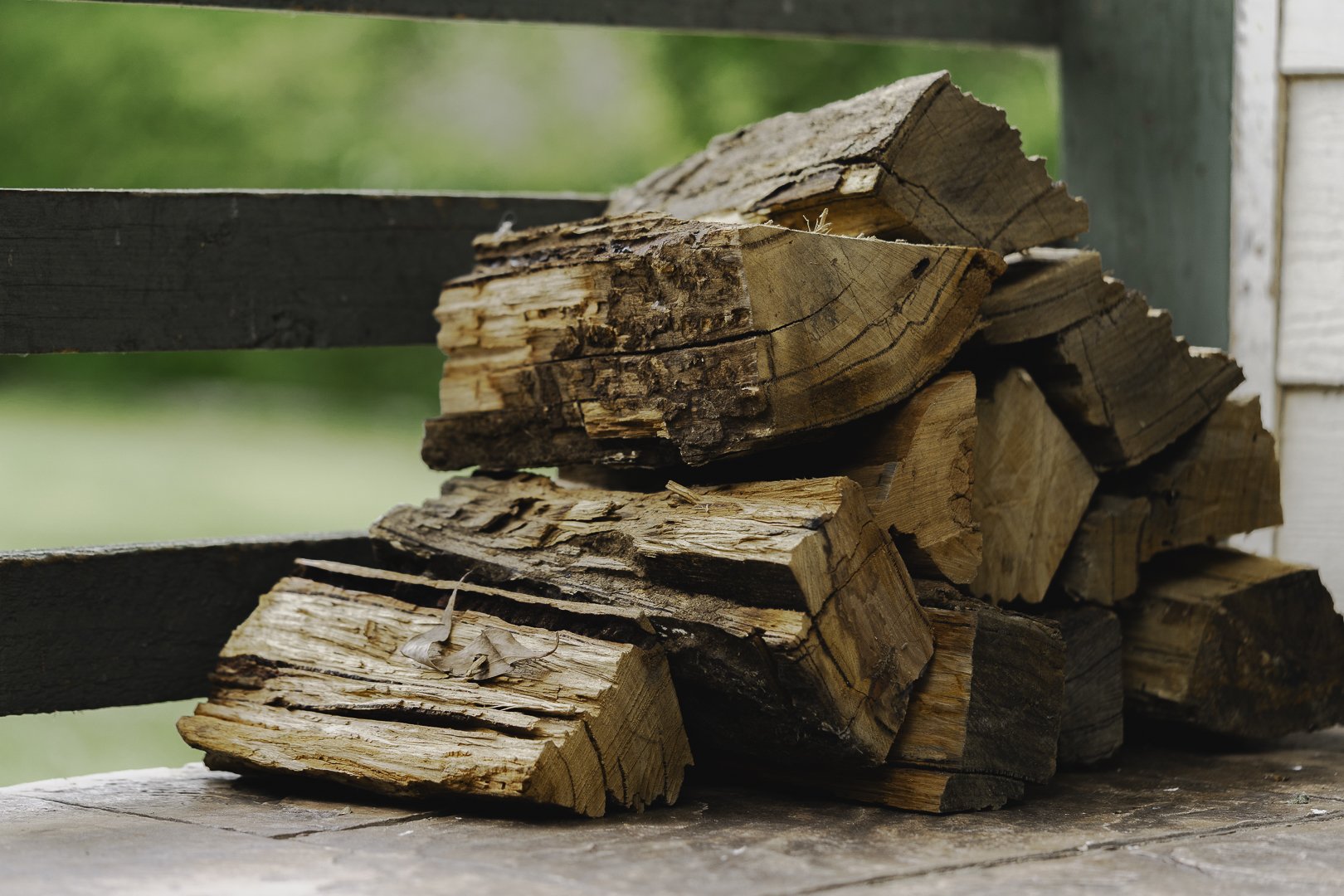 Stacked firewood on the verandah rail