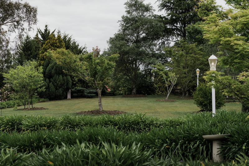 The front garden, lamp posts and lawn