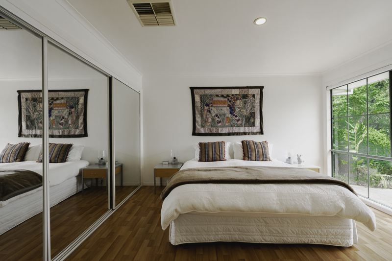 Queen bedroom under a tapestry
