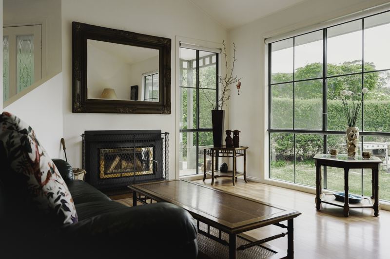 The lounge, fireplace and garden views