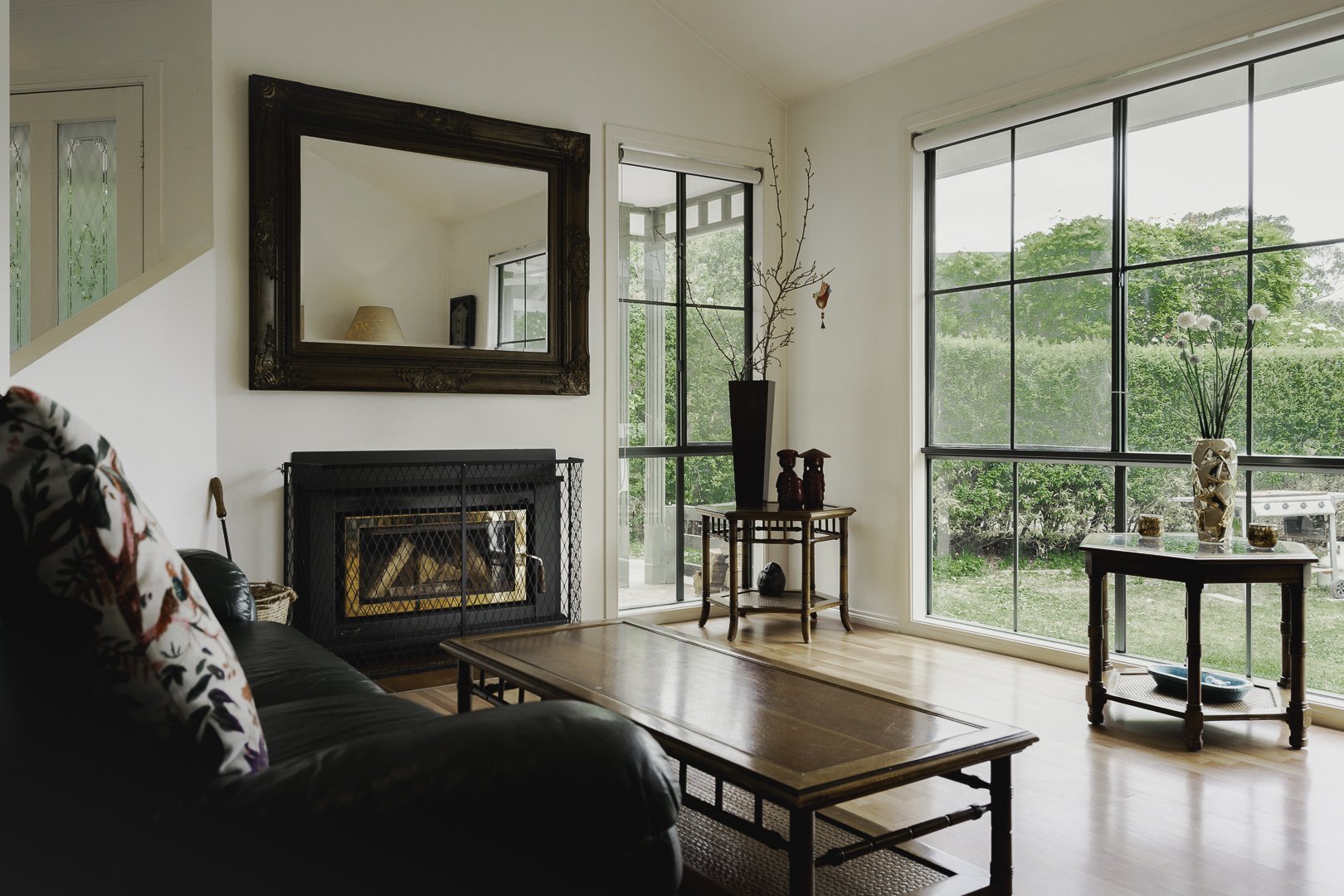 The lounge, fireplace and garden views