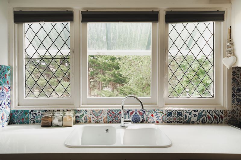 Leadlight windows above the kitchen sink