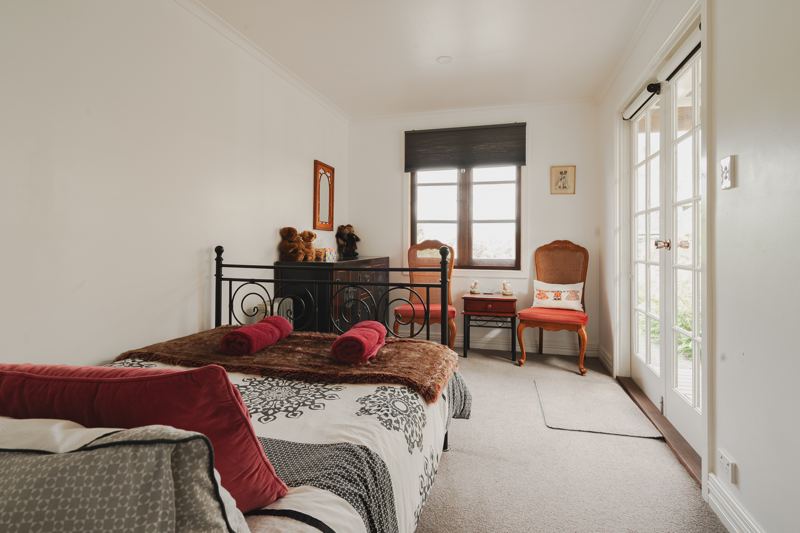 A bedroom with French doors